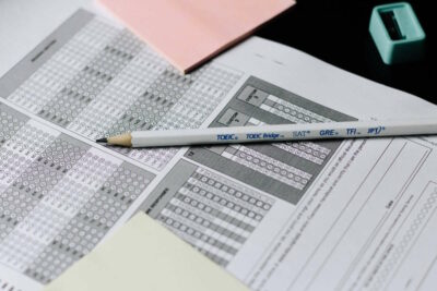 A multiple choice questionnaire with a pencil lying on top of it
