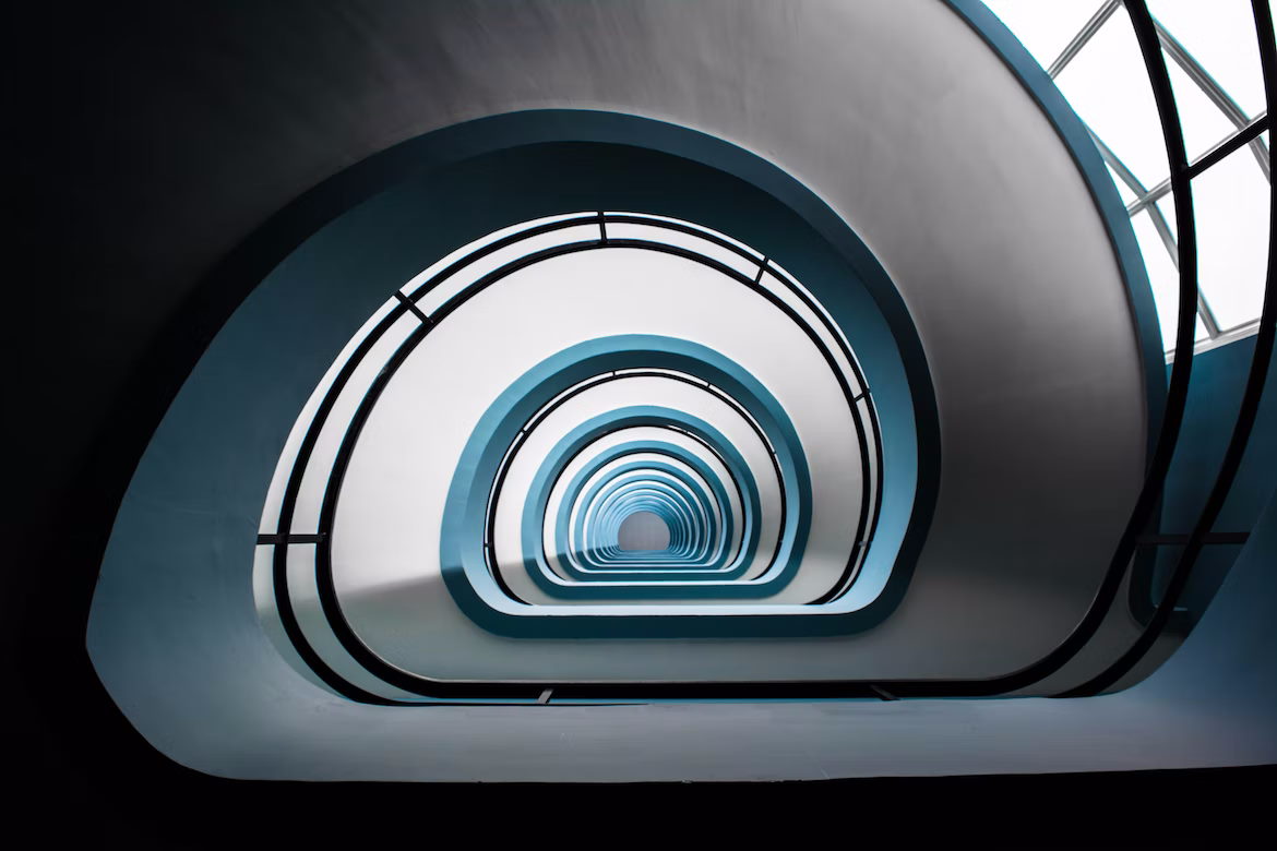 View looking down the centre of a large spiral staircase